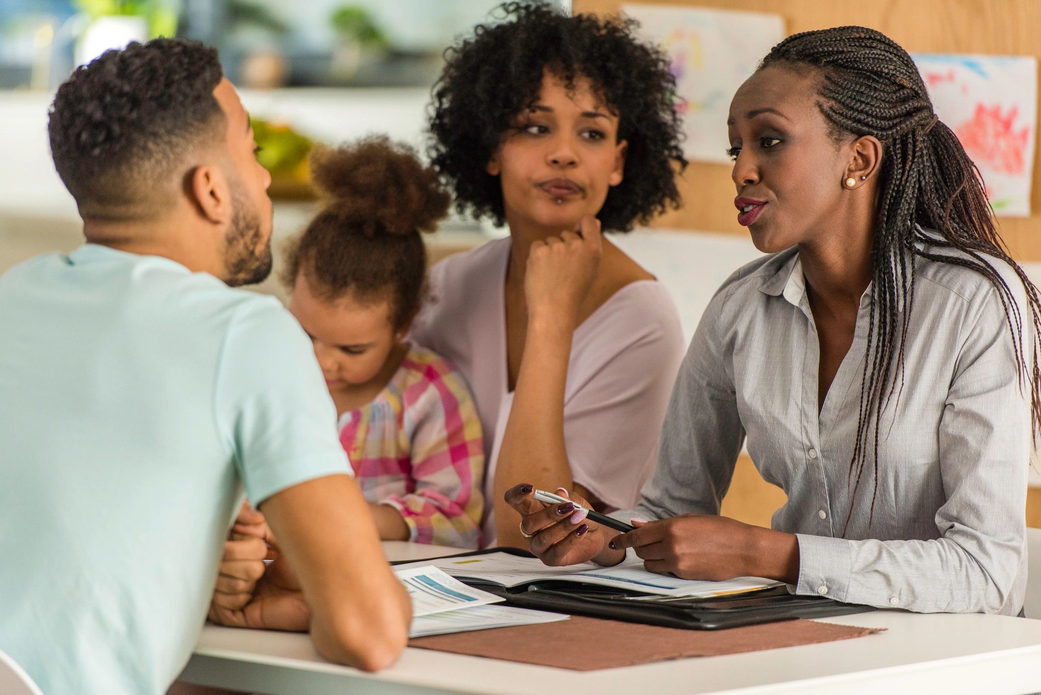 Family gathered around a table discussing advance directives